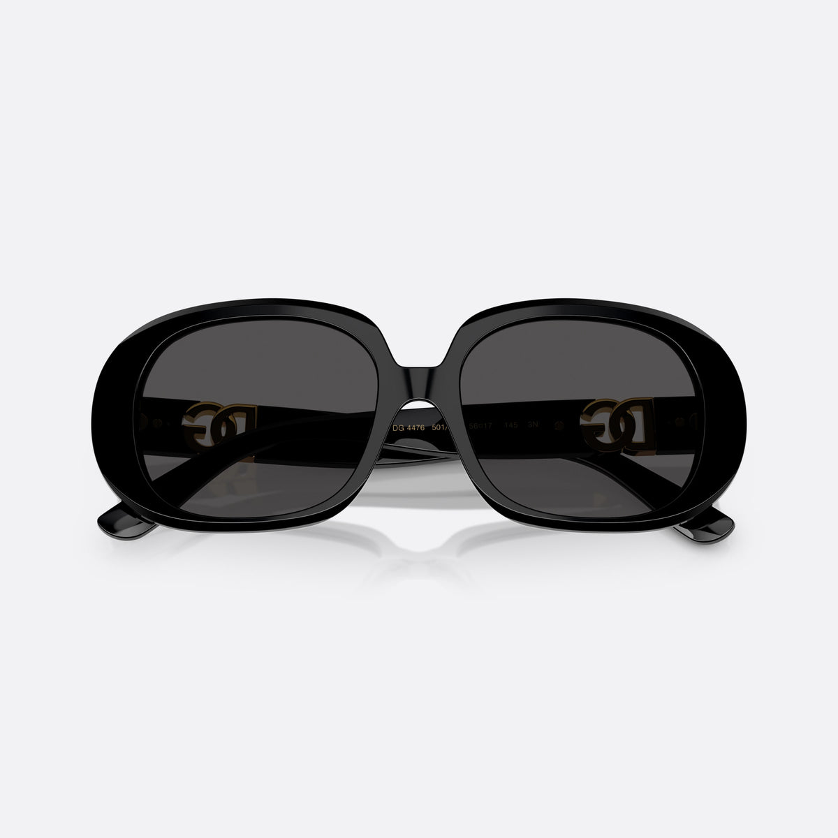 Dolce & Gabbana DG 4476 501/87 sunglasses, black oval frame for women, plain double-arch bridge, brand logo plaque on temples, folded