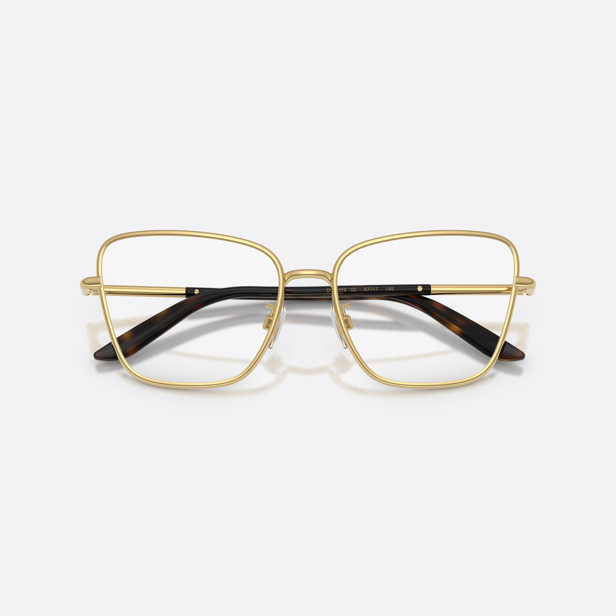 Dolce & Gabbana DG1359 02 eyeglasses, gold cat eye frame for women, plain metal bridge, brand lettering on the temples, folded