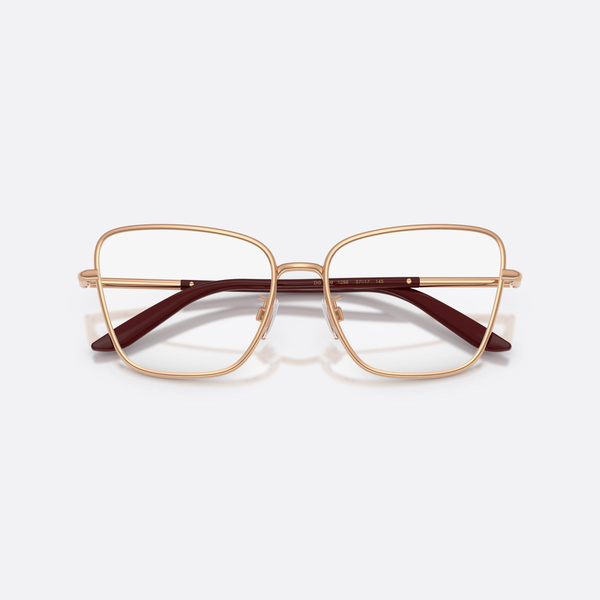 Dolce & Gabbana DG1359 1298 eyeglasses, gold cat eye frame for women, plain metal bridge, brand lettering on temples, folded