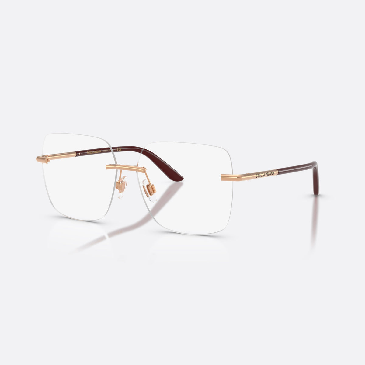 Dolce & Gabbana DG1360 1298 eyeglasses, gold square frame for women, plain metal bridge, brand lettering on temples
