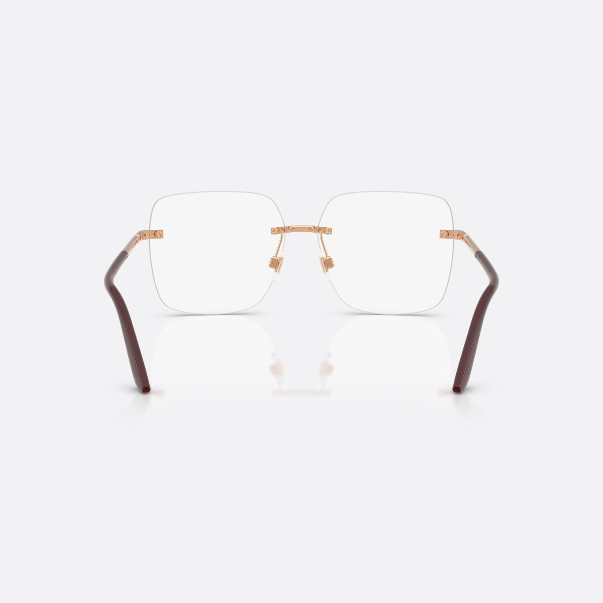 Dolce & Gabbana DG1360 1298 eyeglasses, gold square frame for women, plain metal bridge, brand lettering on temples, back view
