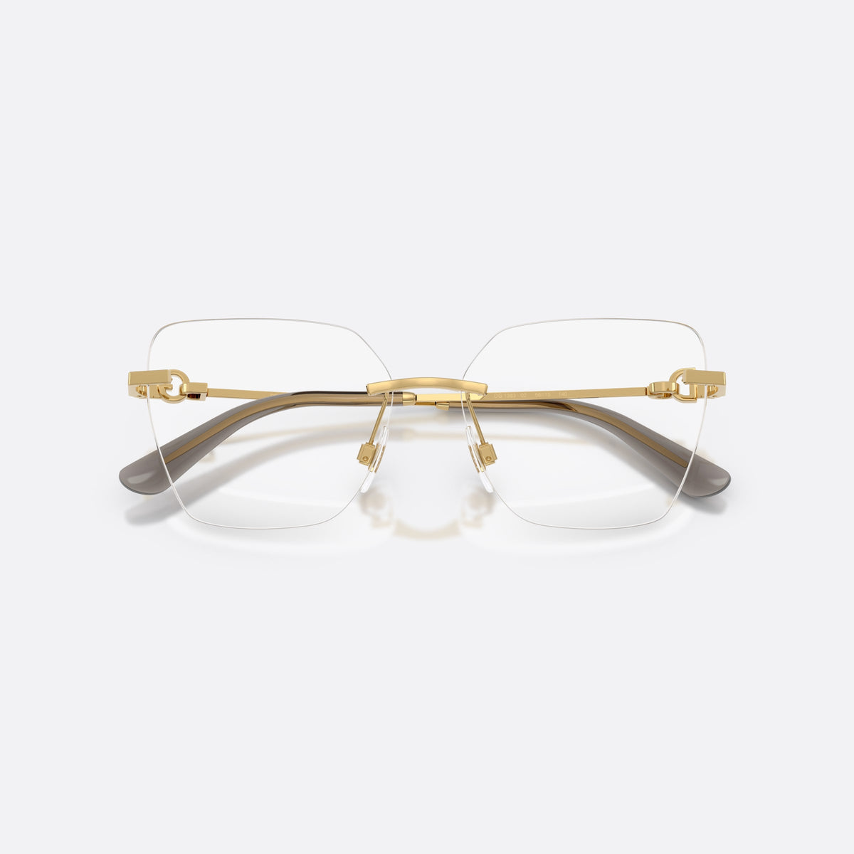 Dolce & Gabbana DG1363 02 eyeglasses, gold cat eye frame for women, metal bridge with gold-tone finish, brand logo on temples, folded