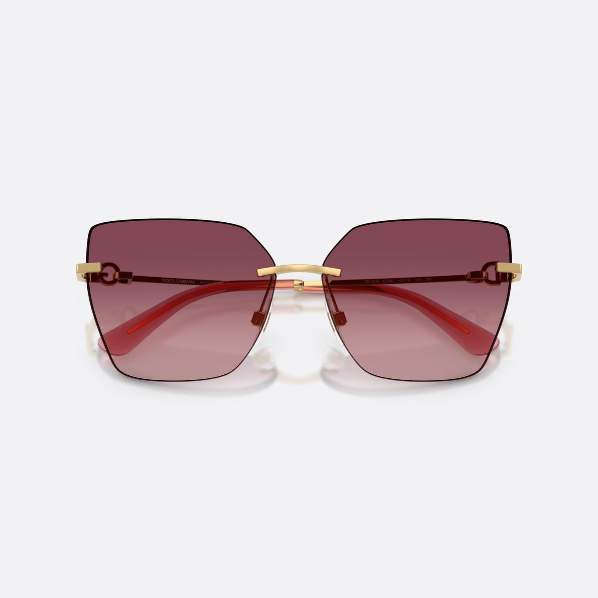 Dolce & Gabbana DG2321 02/8D sunglasses, gold cat eye frame for women, plain metal bridge, brand logo on temples, rimless frame, folded