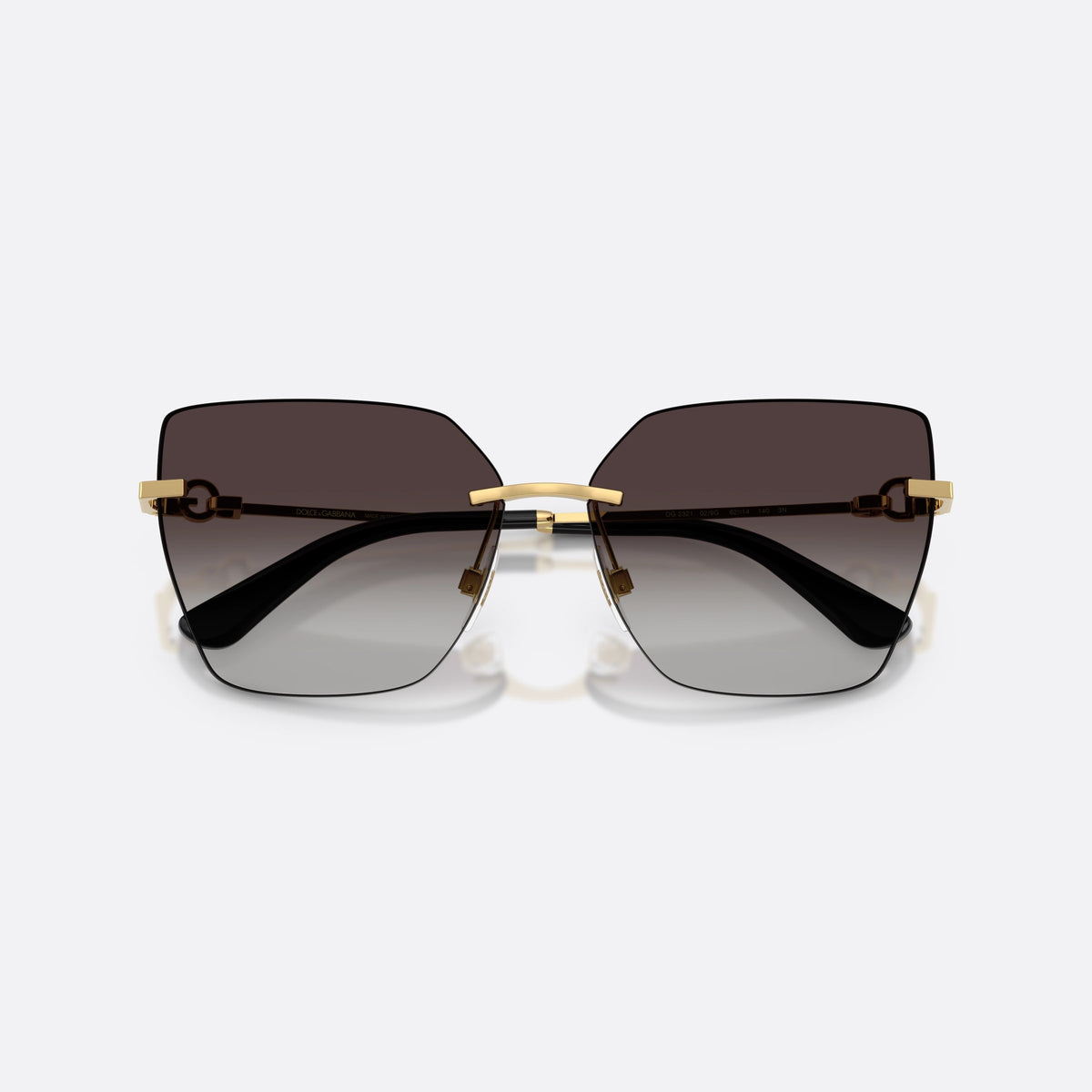 Dolce & Gabbana DG2321 02/8G sunglasses, gold cat eye frame for women, plain metal bridge, brand logo on temples, folded