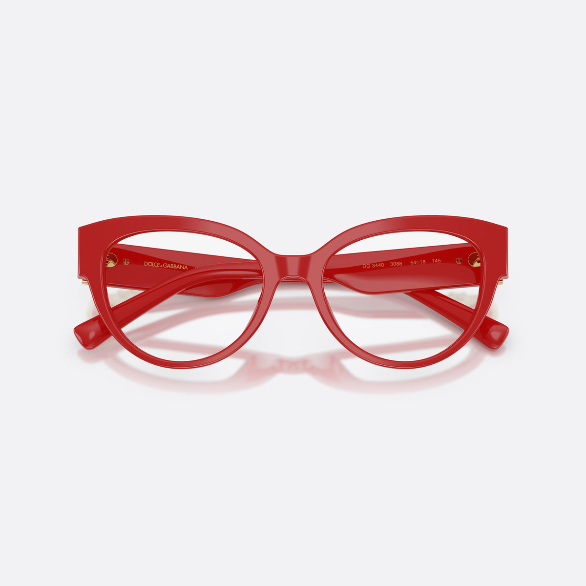 Dolce & Gabbana DG3440 3088 eyeglasses, red cat eye frame for women, plain bridge, brand logo plaque on temple, full rim frame, folded