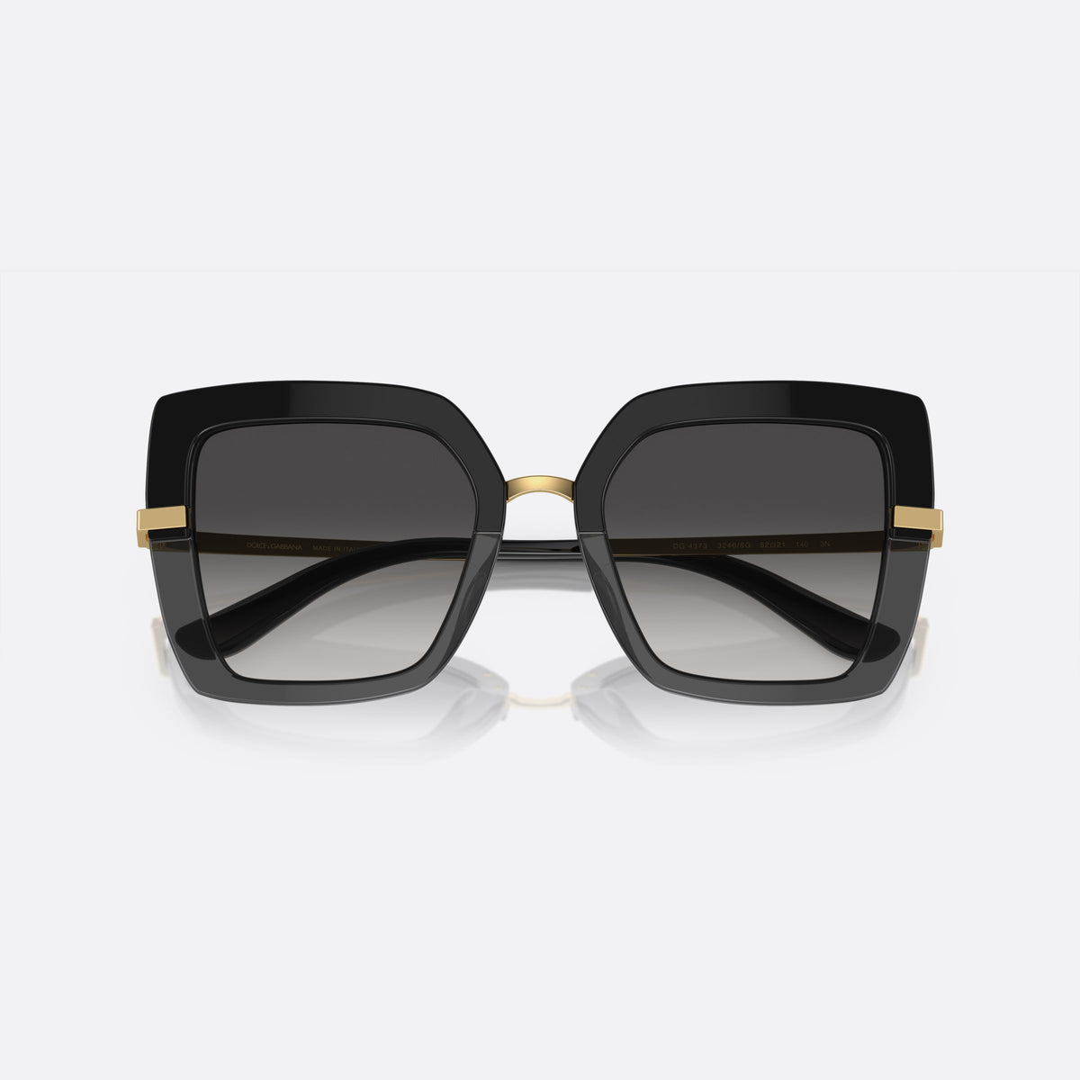 Dolce & Gabbana DG4373 3246/8G sunglasses, black square frame for women, metal bridge with gold-tone finish, gradient tinted lenses, folded
