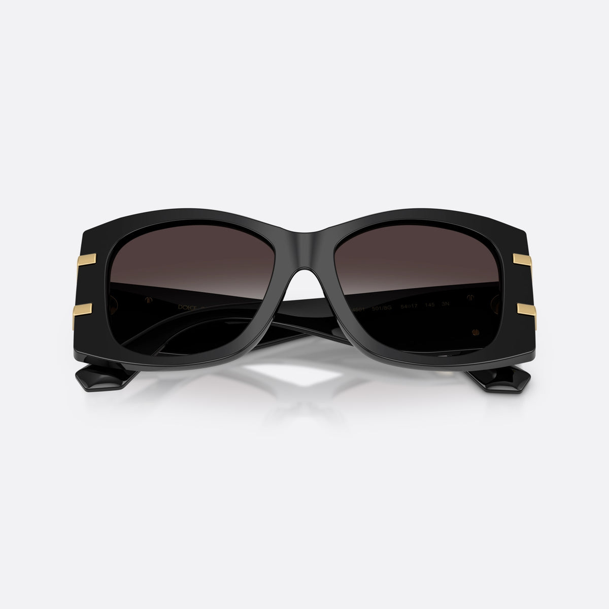 Dolce & Gabbana DG4501 501/8G sunglasses, black butterfly frame for women, plain bridge, integrated into frame, brand logo on temple, folded