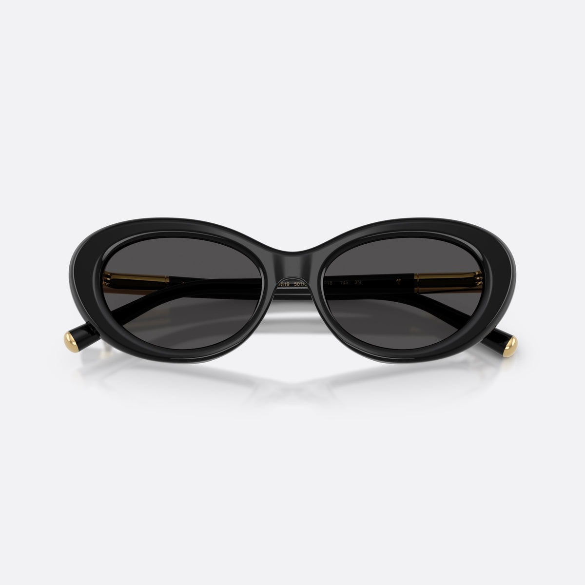 Dolce & Gabbana DG4519 501/87 sunglasses, black oval frame for women, plain bridge, brand logo plaque on temple, folded