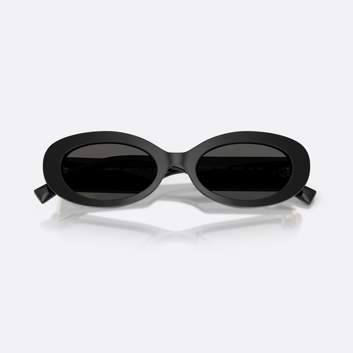Dolce & Gabbana DG4537 501/87 sunglasses, black oval frame for women, plain bridge, brand logo on plaque, full-rim frame, folded