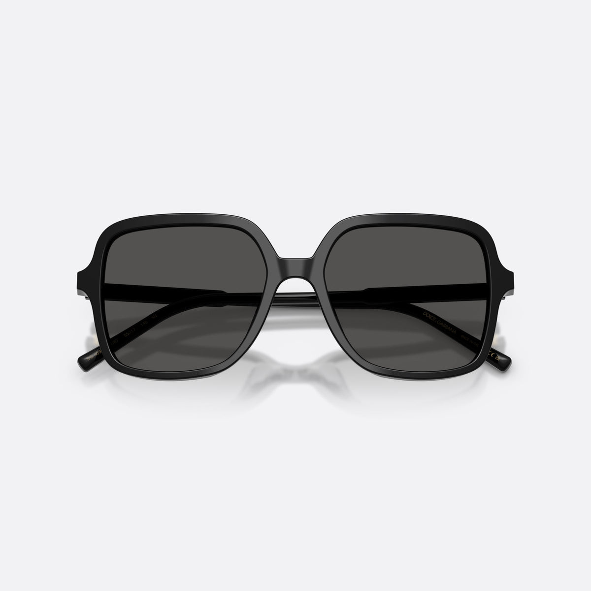 Dolce & Gabbana DG4539 501/87 sunglasses, black square frame for women, plain double bridge, brand lettering on temples, folded