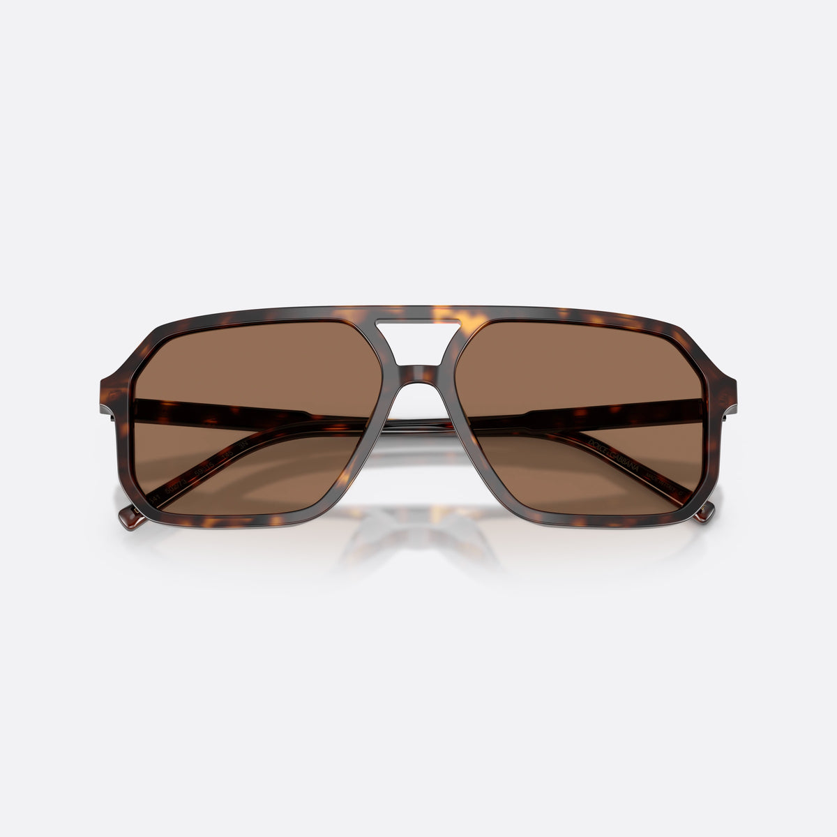 Dolce & Gabbana DG4541 502/73 sunglasses, havana pilot frame, unisex, double bridge with open center, brand lettering on temples, folded