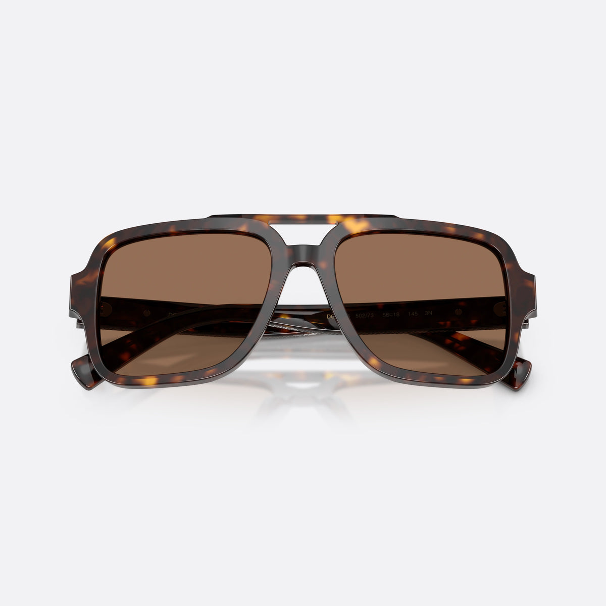 Dolce & Gabbana DG4544 502/73 sunglasses, havana pilot frame for men, double bridge with top bar, brand lettering on temples, folded
