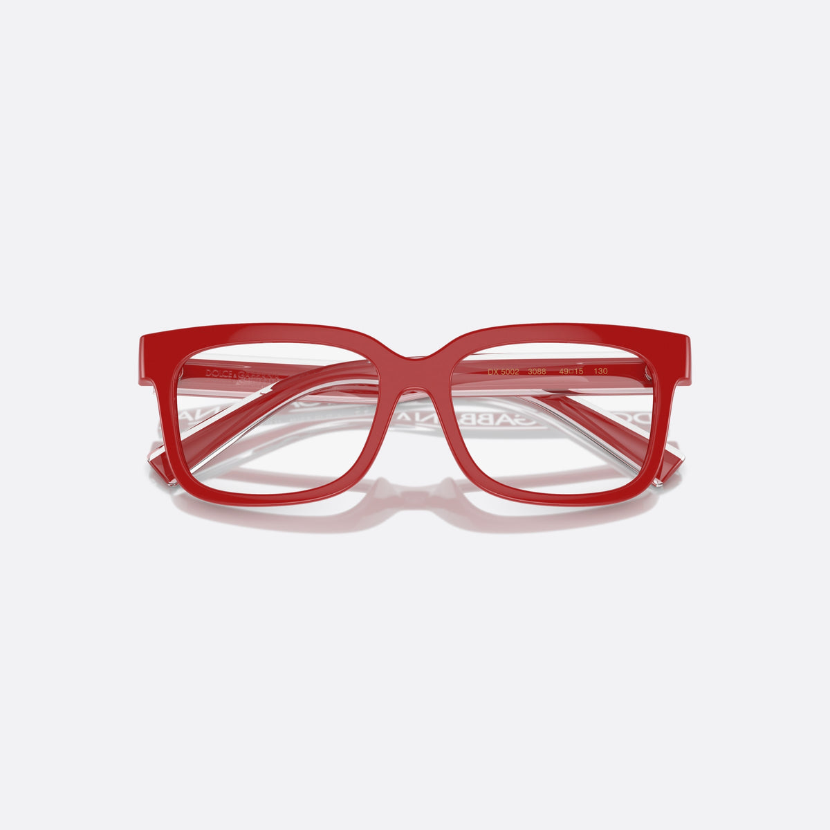 Dolce & Gabbana DX5002 3088 eyeglasses, red rectangle frame for kids, plain integrated bridge, brand lettering on temples, folded