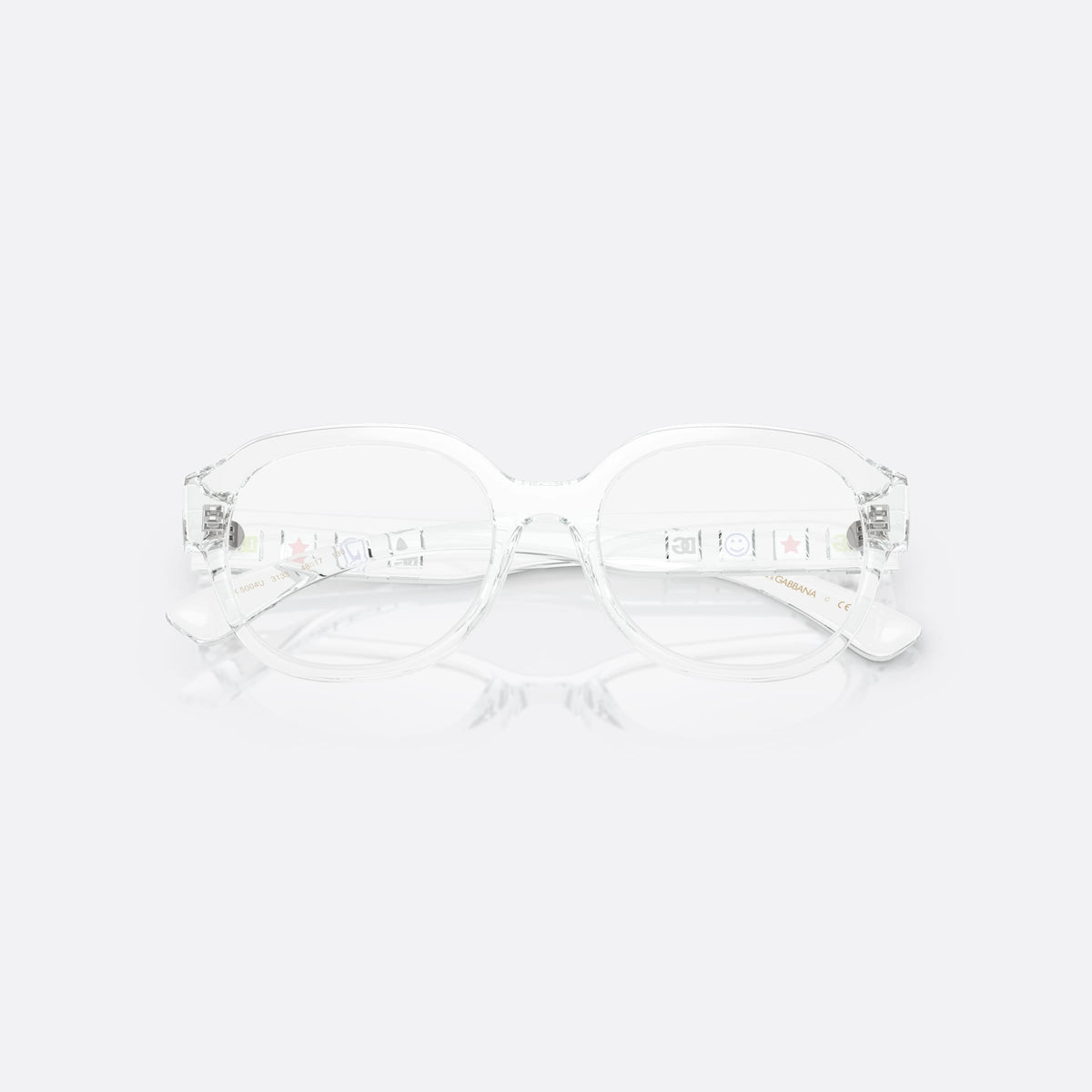 Dolce & Gabbana DX5004U 3133 eyeglasses, clear round frame for kids, plain bridge with smooth arc, brand logo on temples, folded