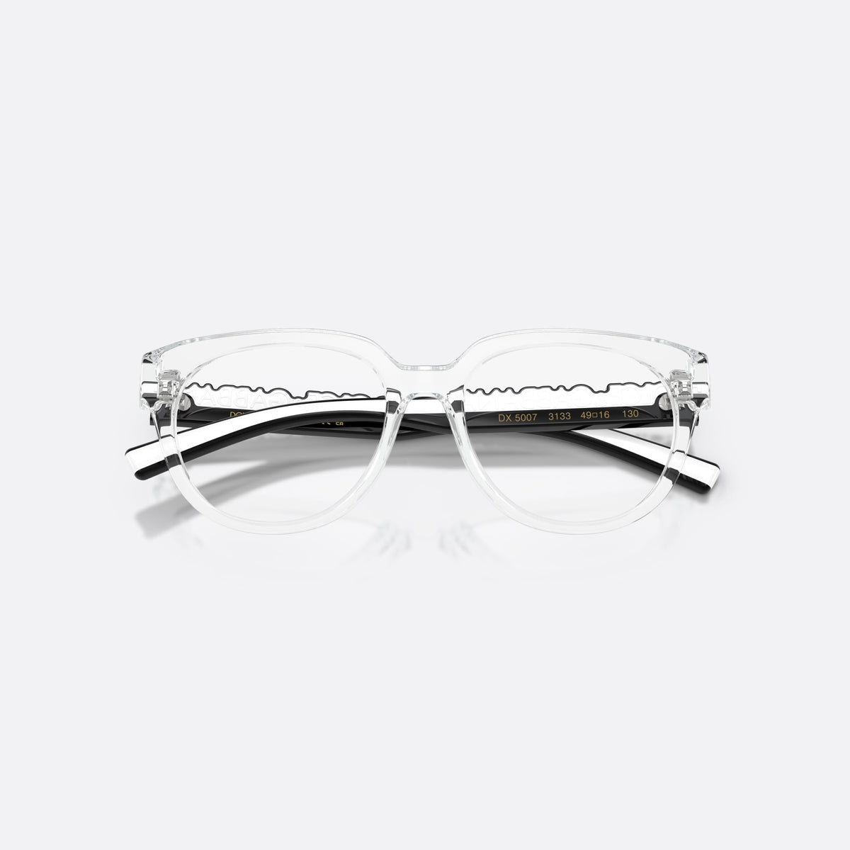 Dolce & Gabbana DX5007 3133 eyeglasses, clear phantos frame for kids, plain bridge, brand lettering on temples, folded