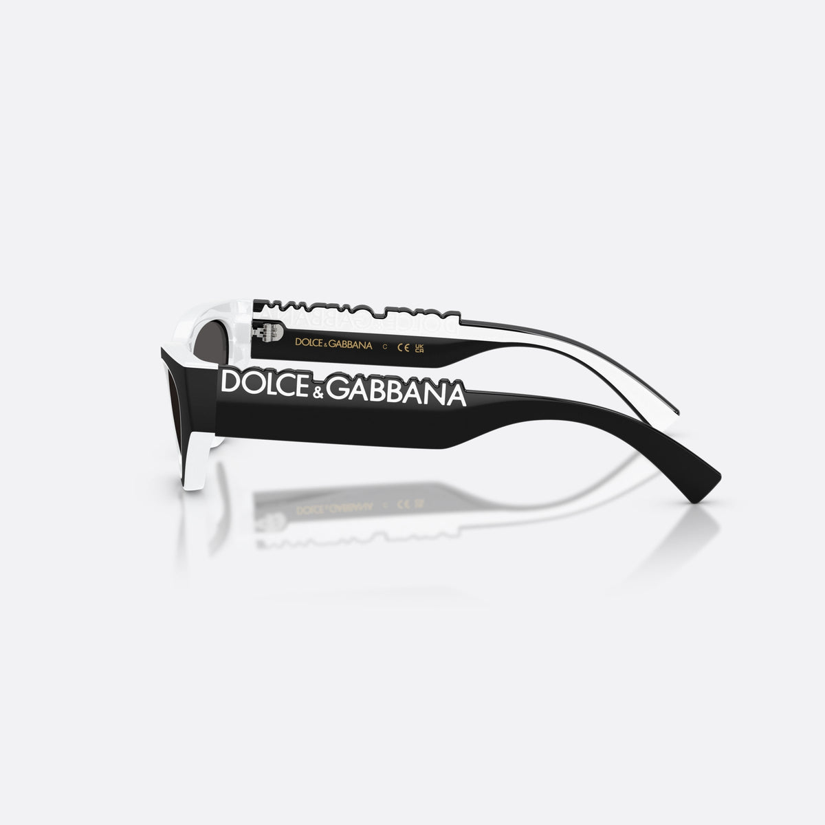 Dolce & Gabbana DX6012 345787 sunglasses, black cat eye frame for kids, plain bridge joining lenses, black hinges on temples, side view