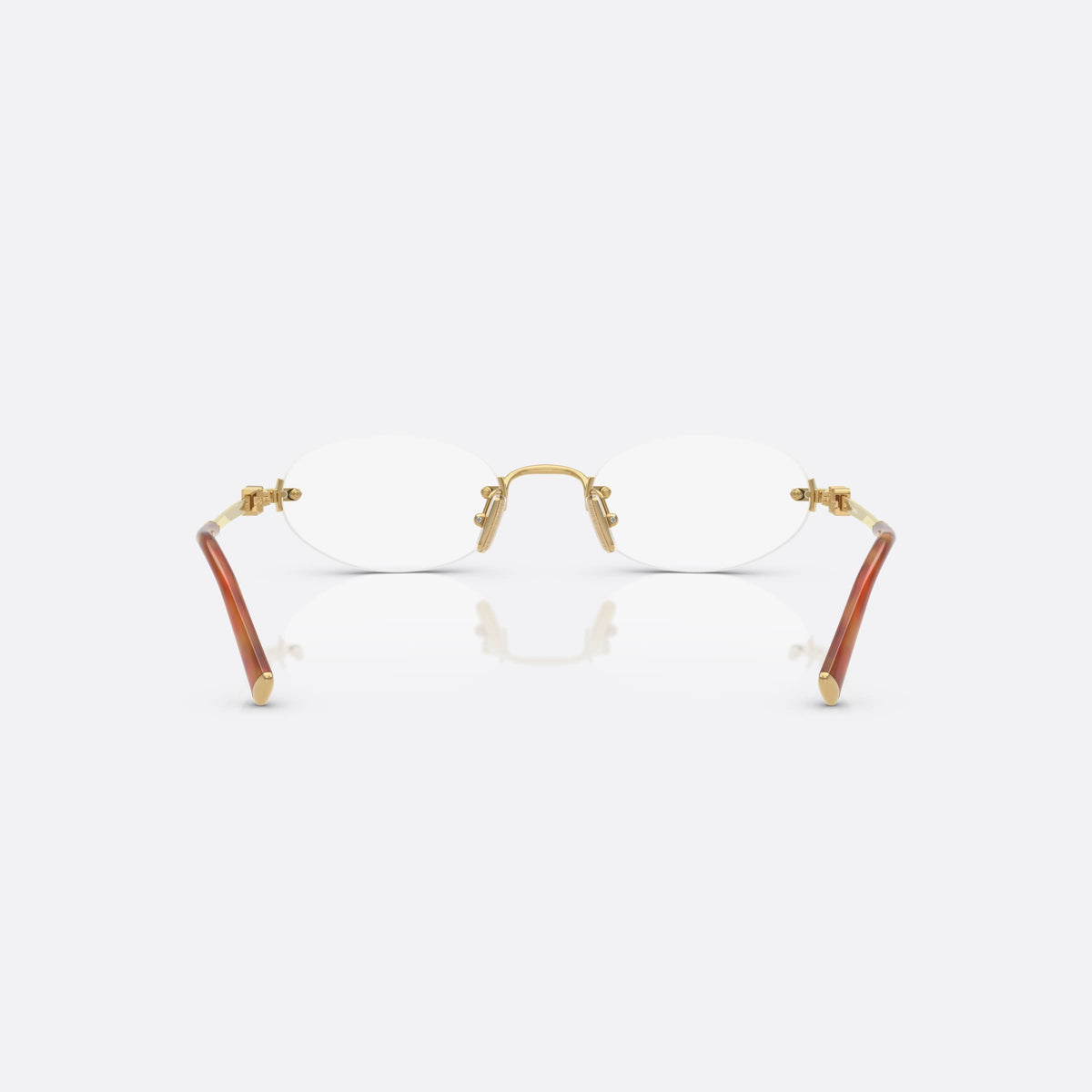 Miu Miu 0MU 53WV 5AK1O1 eyeglasses, gold oval frame for women, metal bridge with arch, brand lettering on temples, back view