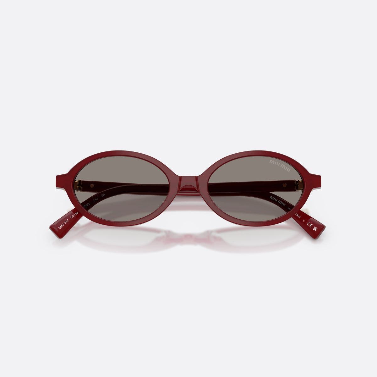 Miu Miu MU 04ZS 21I80Q sunglasses, red oval frame for women, plain bridge, brand lettering on temples, full-rim frame, folded