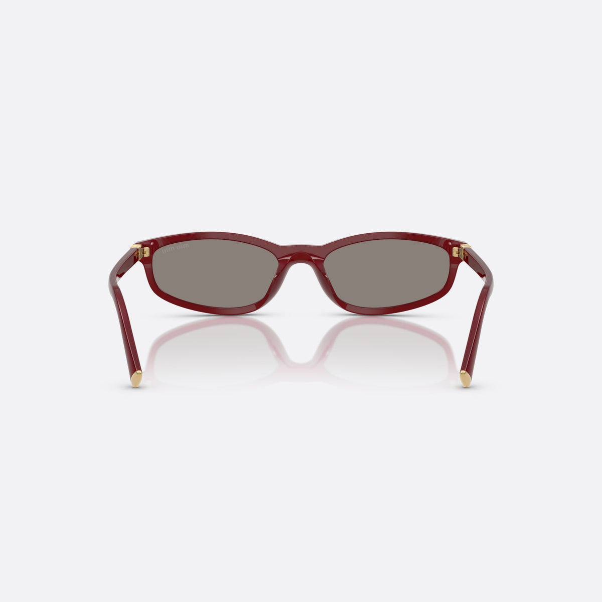 Miu Miu MU A06S 21I80Q sunglasses, red irregular frame for women, plain integrated bridge, brand lettering on temples, back view