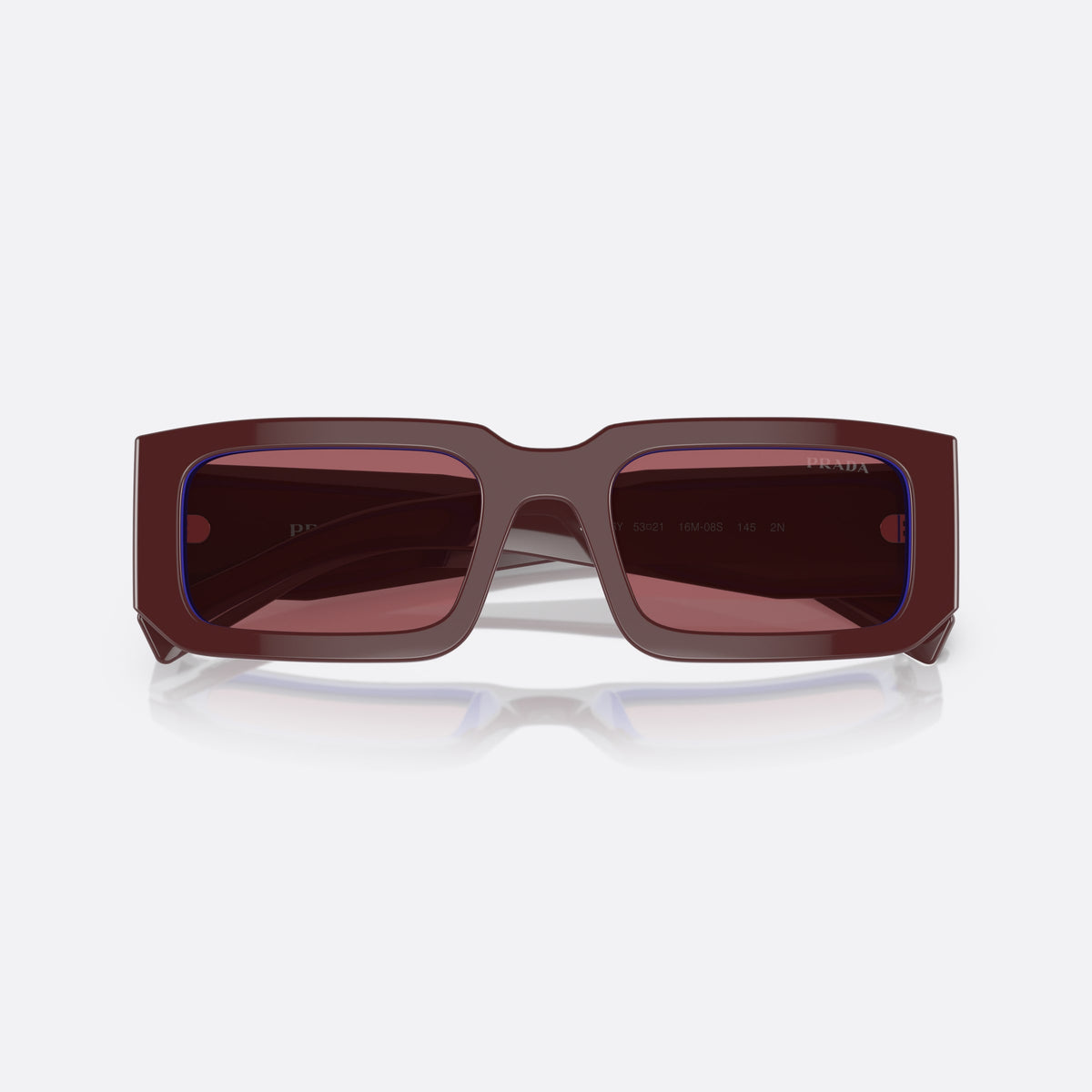 Prada PR 06YS 06YS sunglasses, red rectangle frame, unisex, plain integrated bridge, brand lettering on temples, folded