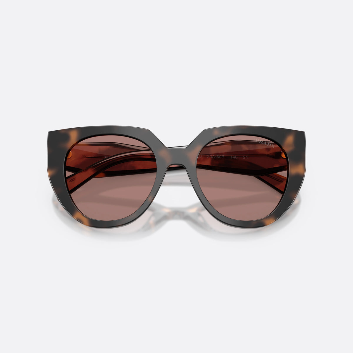 Prada PR 14WS 23A60B sunglasses, havana cat eye frame for women, plain bridge joining lenses, brand lettering on temples, folded