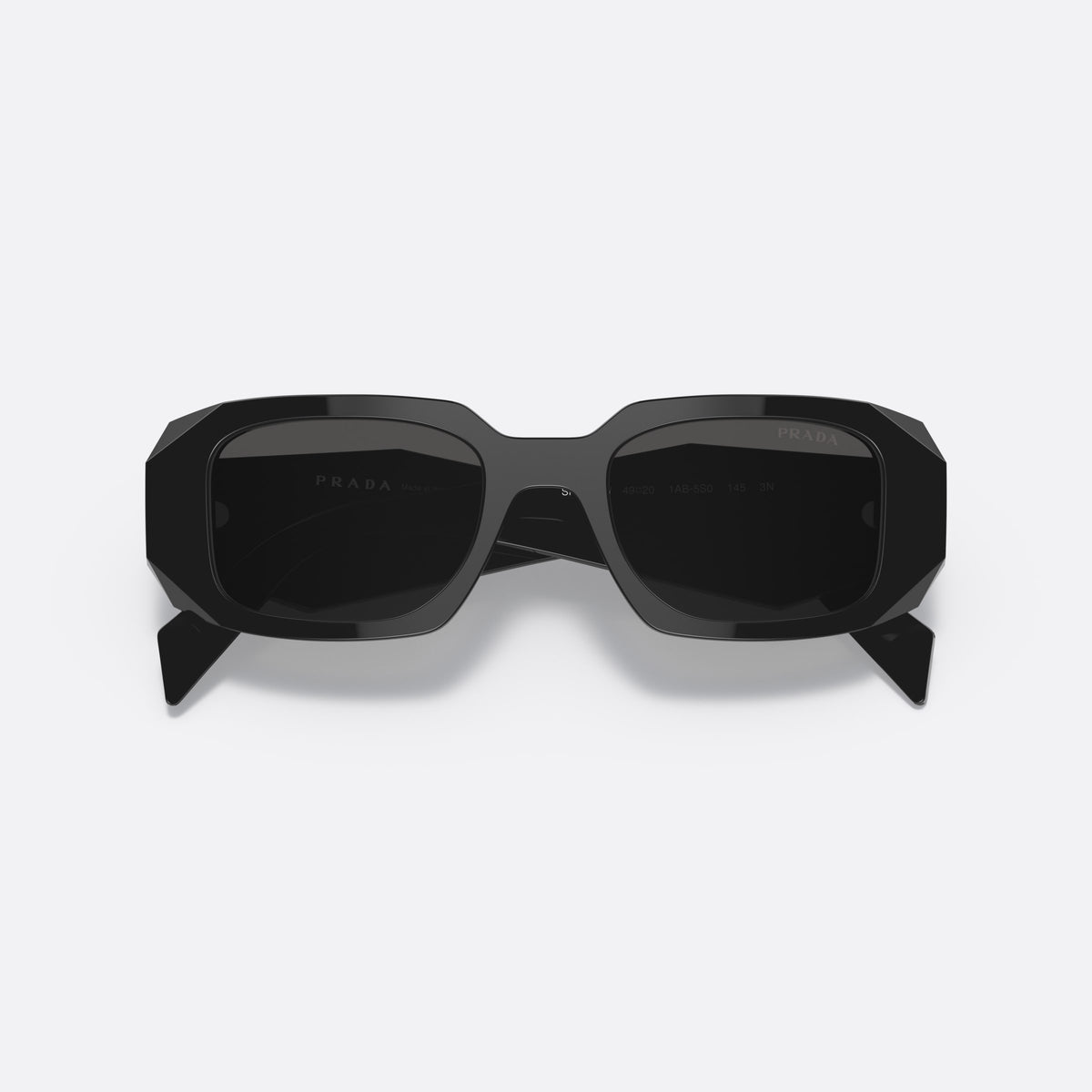Prada PR 17WS 1AB-5S0 sunglasses, black rectangle frame, unisex, plain bridge, brand lettering on temples, plaque on temples, folded