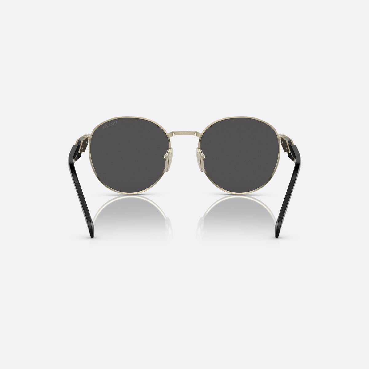 Prada PR 56ZS ZVN-5S0 sunglasses, gold round frame for women, plain metal bridge, brand lettering on temples, back view