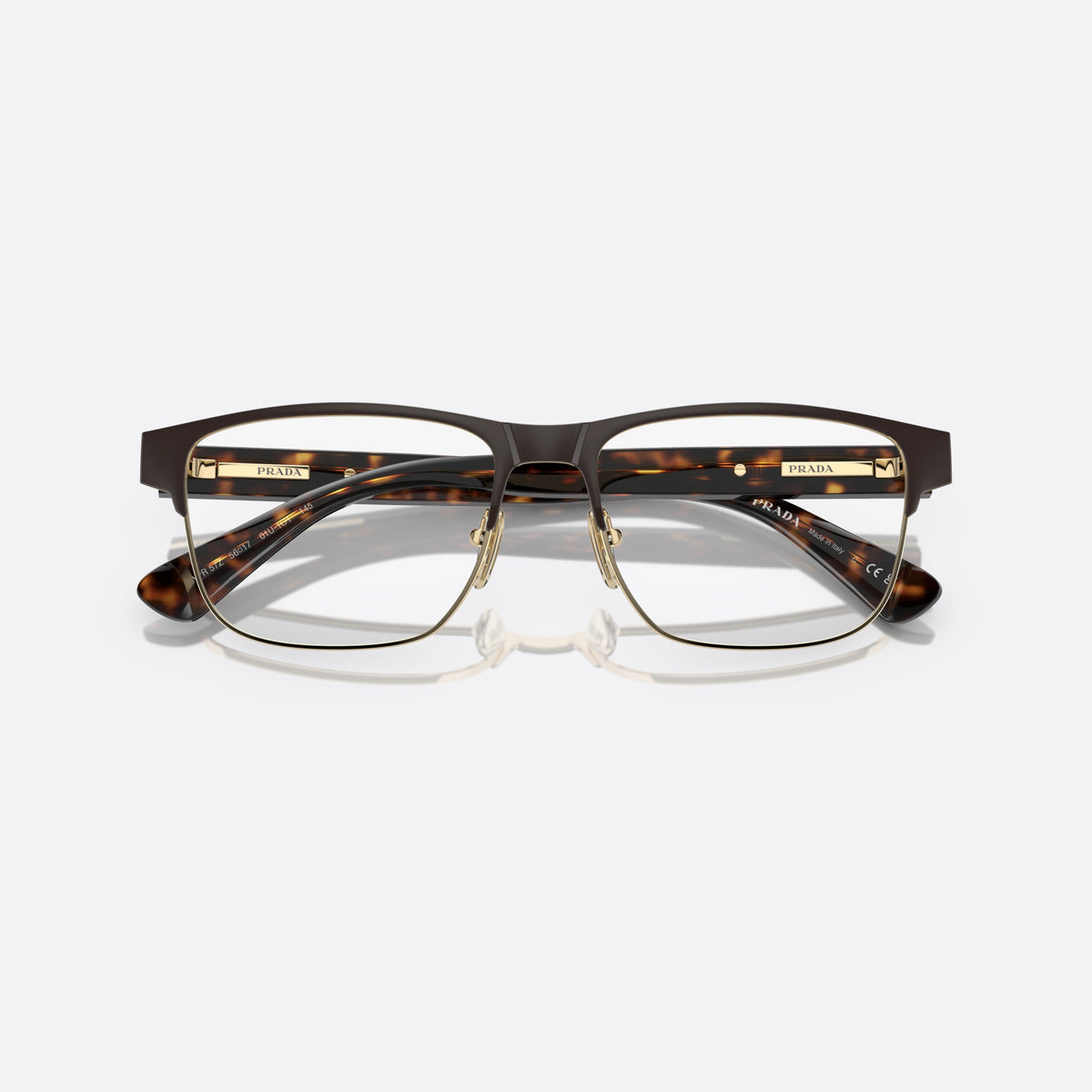 Prada PR 57ZV 01U-1O1 N eyeglasses, brown squared frame for men, saddle bridge with metal, brand lettering on the temples, folded