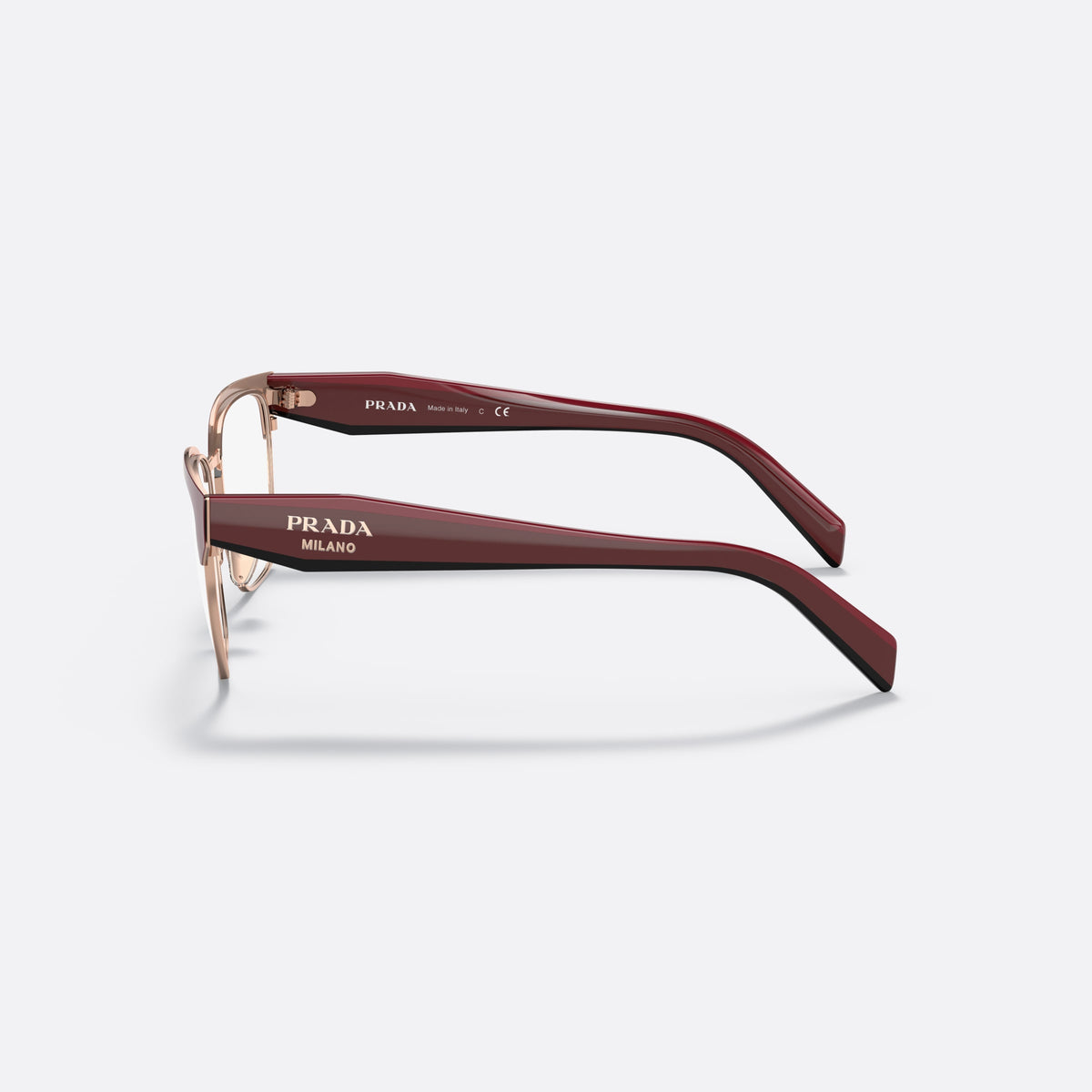 Prada PR 65YV 16A1O1 eyeglasses, red irregular frame for women, saddle-style metal bridge, brand lettering on the temples, side view