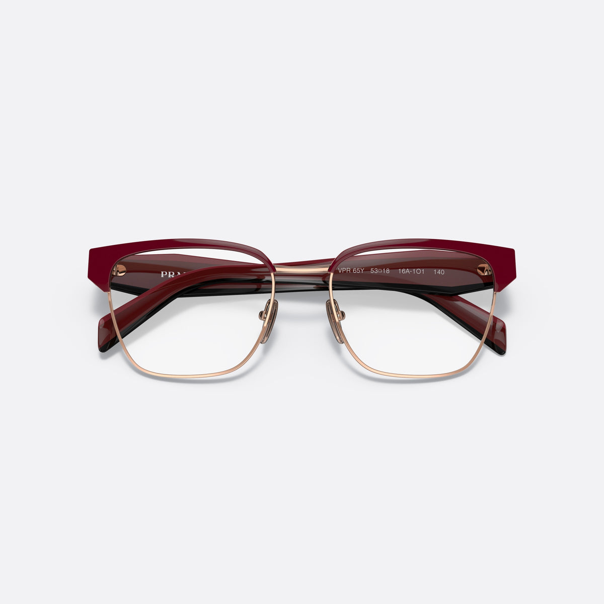 Prada PR 65YV 16A1O1 eyeglasses, red irregular frame for women, saddle-style metal bridge, brand lettering on the temples, folded