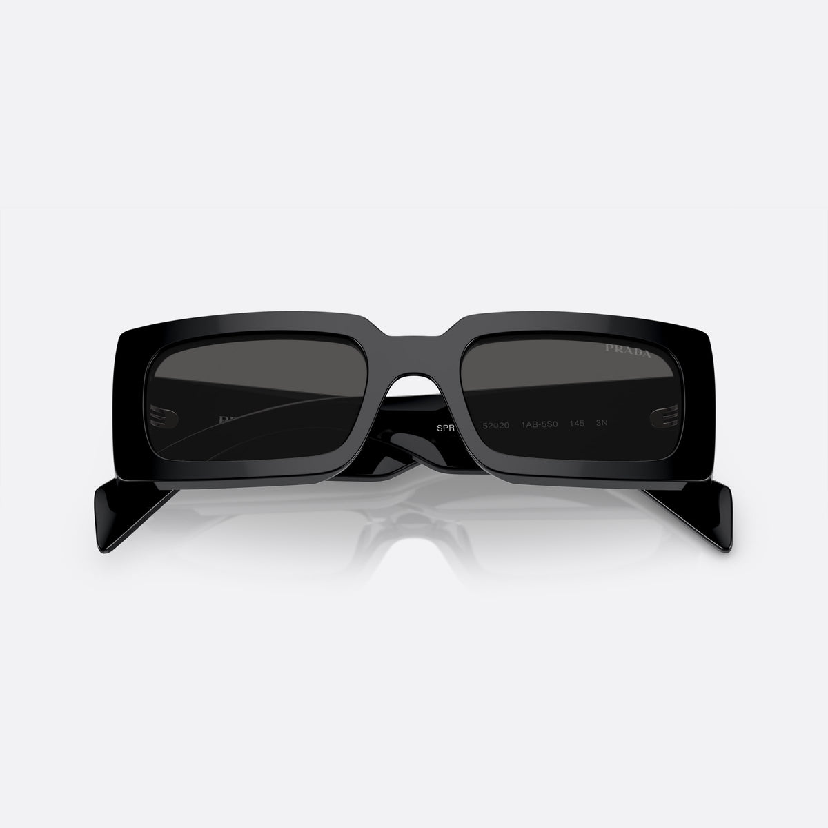 Prada PR A07S 1AB-5S0 N sunglasses, black pillow frame for women, plain bridge, brand lettering on temples, full-rim frame, folded