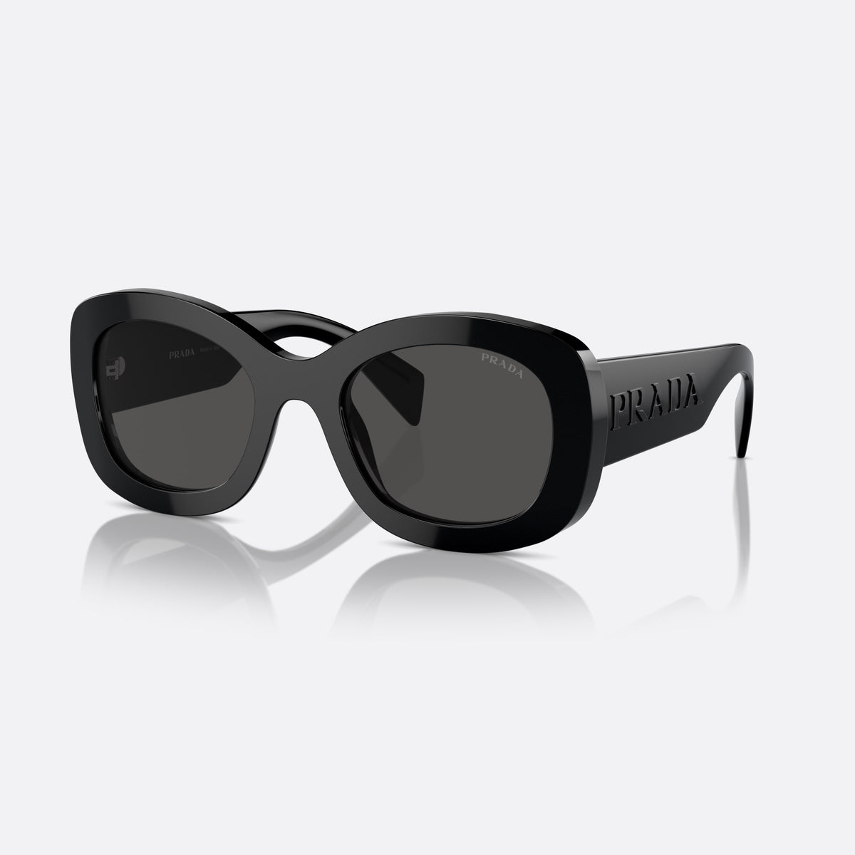 Prada PR A13S 1AB-5S0 B sunglasses, black oval frame for women, plain saddle style bridge, raised brand lettering on temples