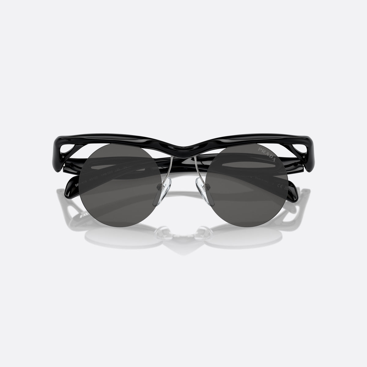 Prada PR A18S 1AB5S0 sunglasses, black round frame for men, double bridge with wavy top, folded