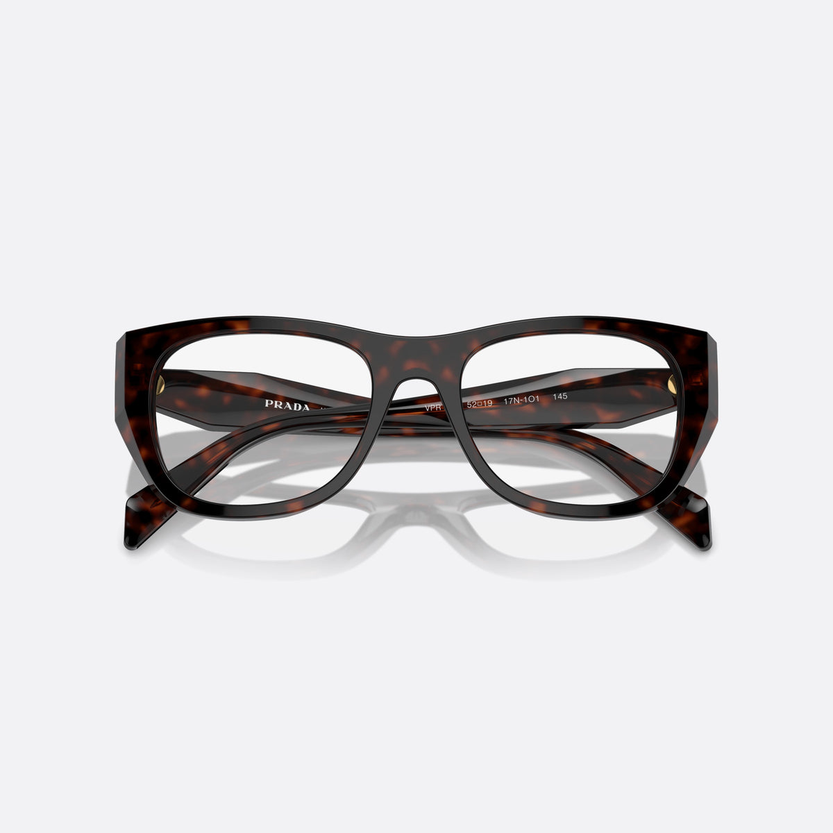 Prada PR A18V 17N-1O1 RT eyeglasses, havana geometric frame for women, plain saddle-style bridge, brand lettering on temples, folded