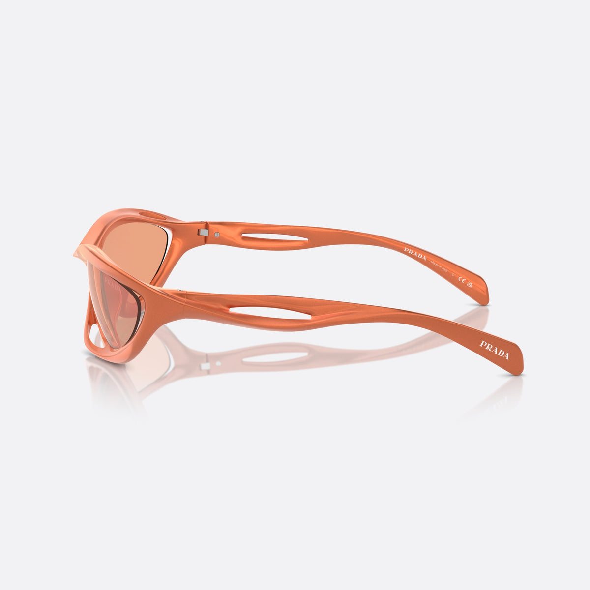 Prada PR A23S 15V50H sunglasses, orange cat eye frame for women, integrated double bridge, brand lettering on the temples, side view