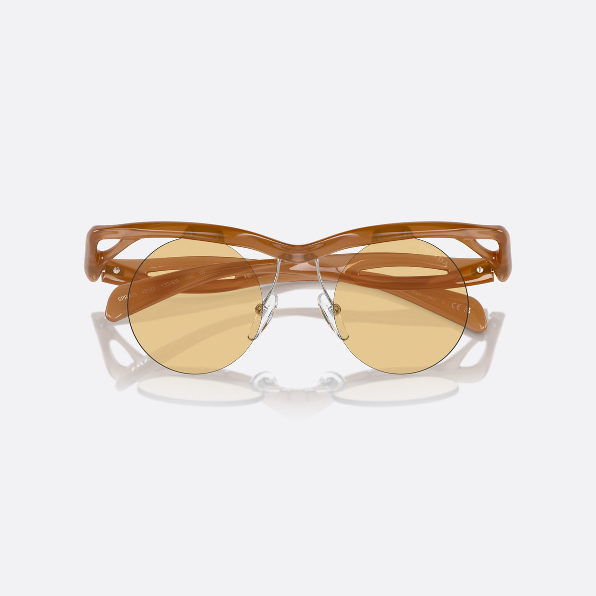 Prada PR A24S 13S80E sunglasses, brown round frame for women, brand lettering on the temples, solid tinted lenses, folded
