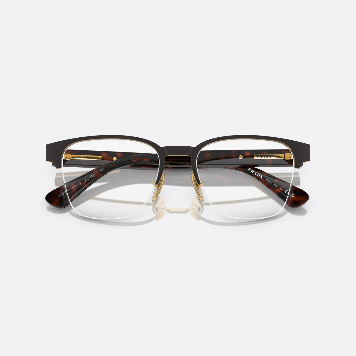 Prada PR A52V 01U-1O1 N eyeglasses, brown geometric frame for men, plain metal bridge, brand lettering on temples, folded