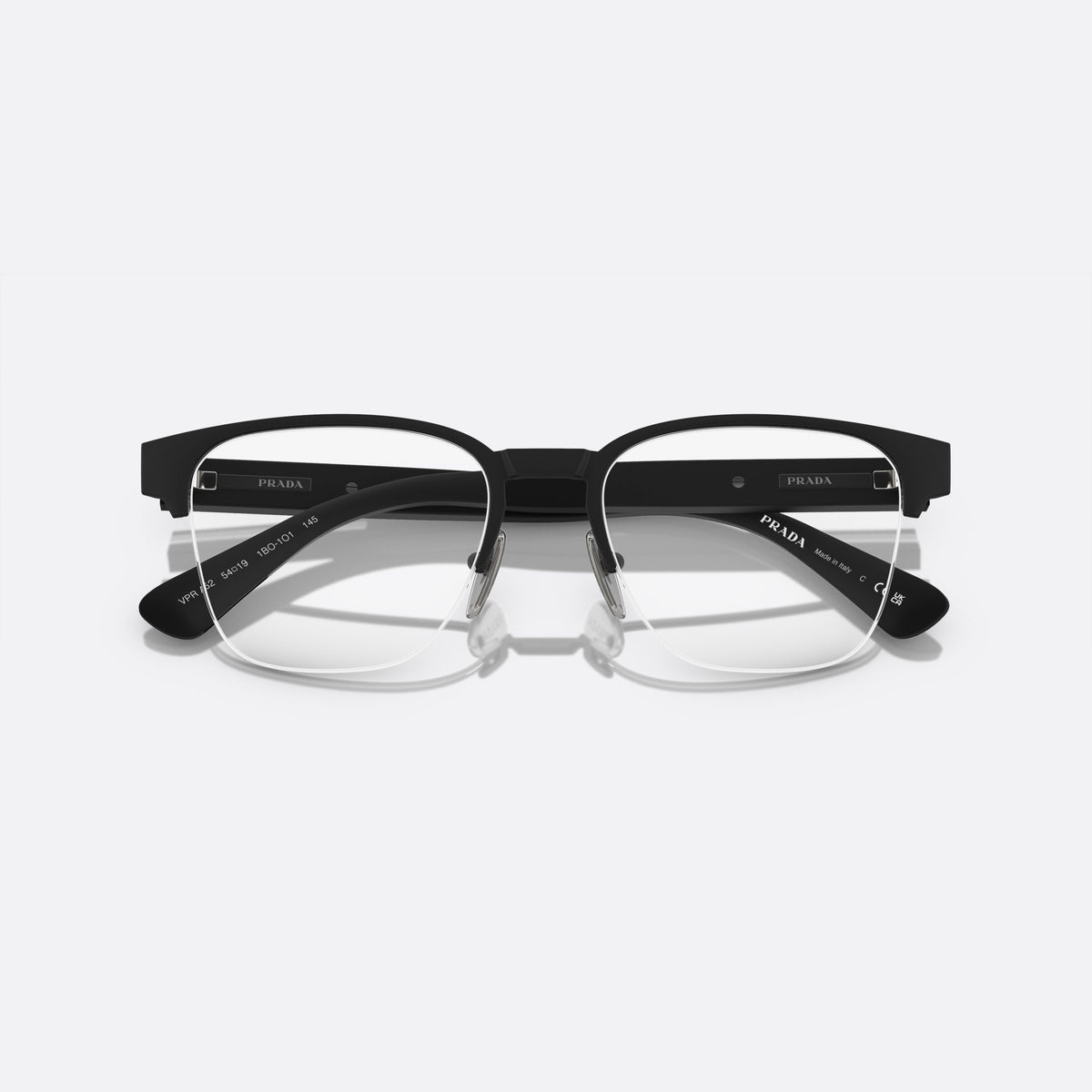 Prada PR A52V 1BO-1O1 X eyeglasses, black geometric frame for men, plain metal bridge, brand lettering on temples, folded