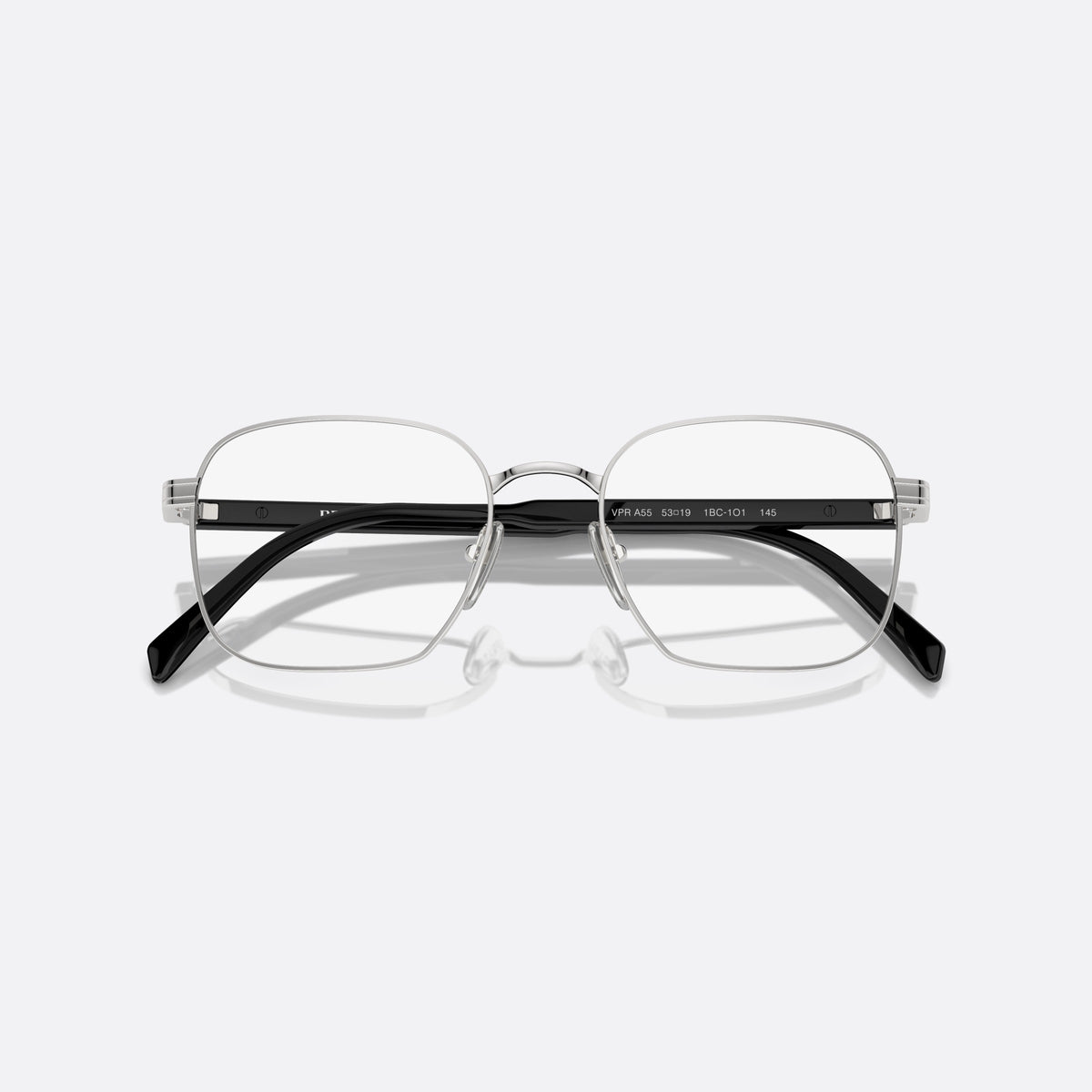 Prada PR A55V 1BC1O1 eyeglasses, silver round frame for men, plain metal bridge, brand lettering on temples, folded