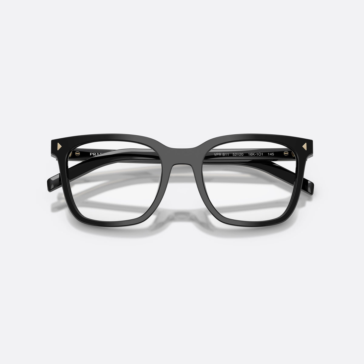 Prada PR B11V 16K1O1 eyeglasses, black pillow frame for women, plain bridge, brand lettering on temples, full-rim frame, folded