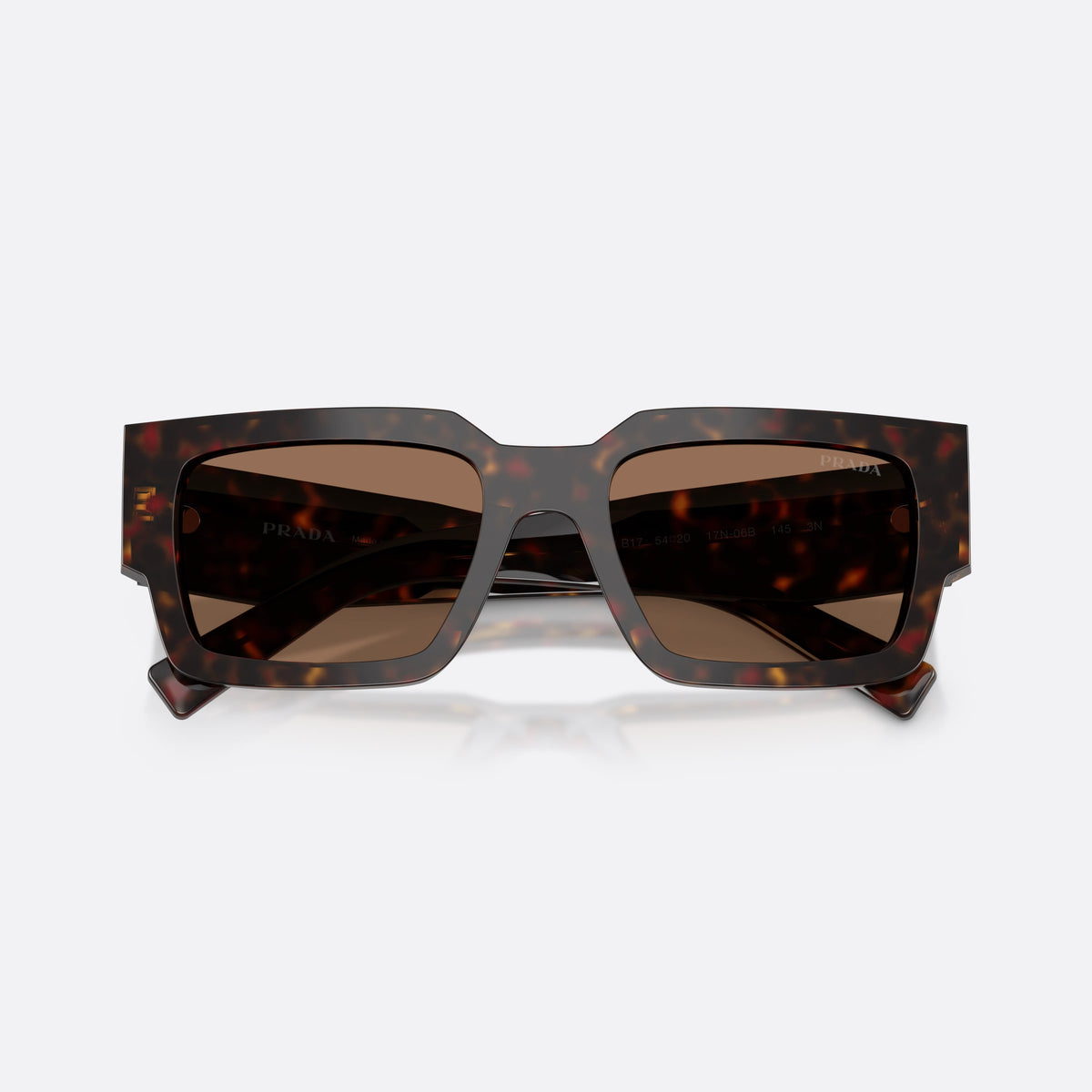 Prada PR B17S 17N06B sunglasses, havana rectangle frame for men, plain integrated bridge, brand lettering on temples, folded