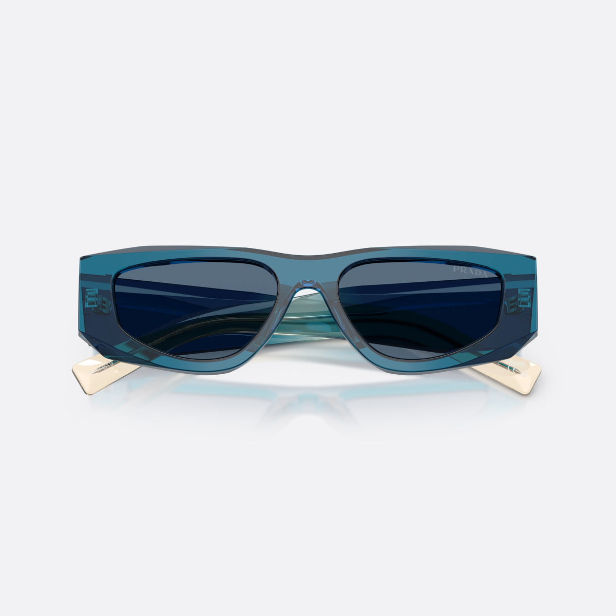 Prada PR B19S 24F80S sunglasses, blue pillow frame for men, integrated bridge, brand lettering on temples, folded