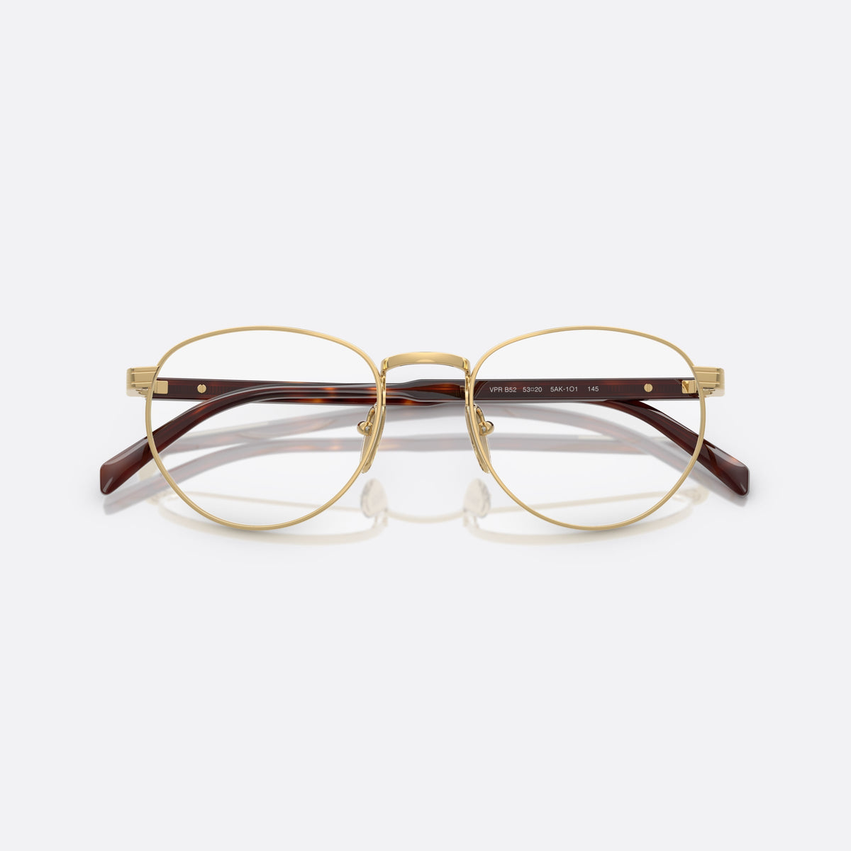 Prada PR B52V 5AK1O1 eyeglasses, gold visor frame for men, plain metal bridge, brand lettering on temples, folded