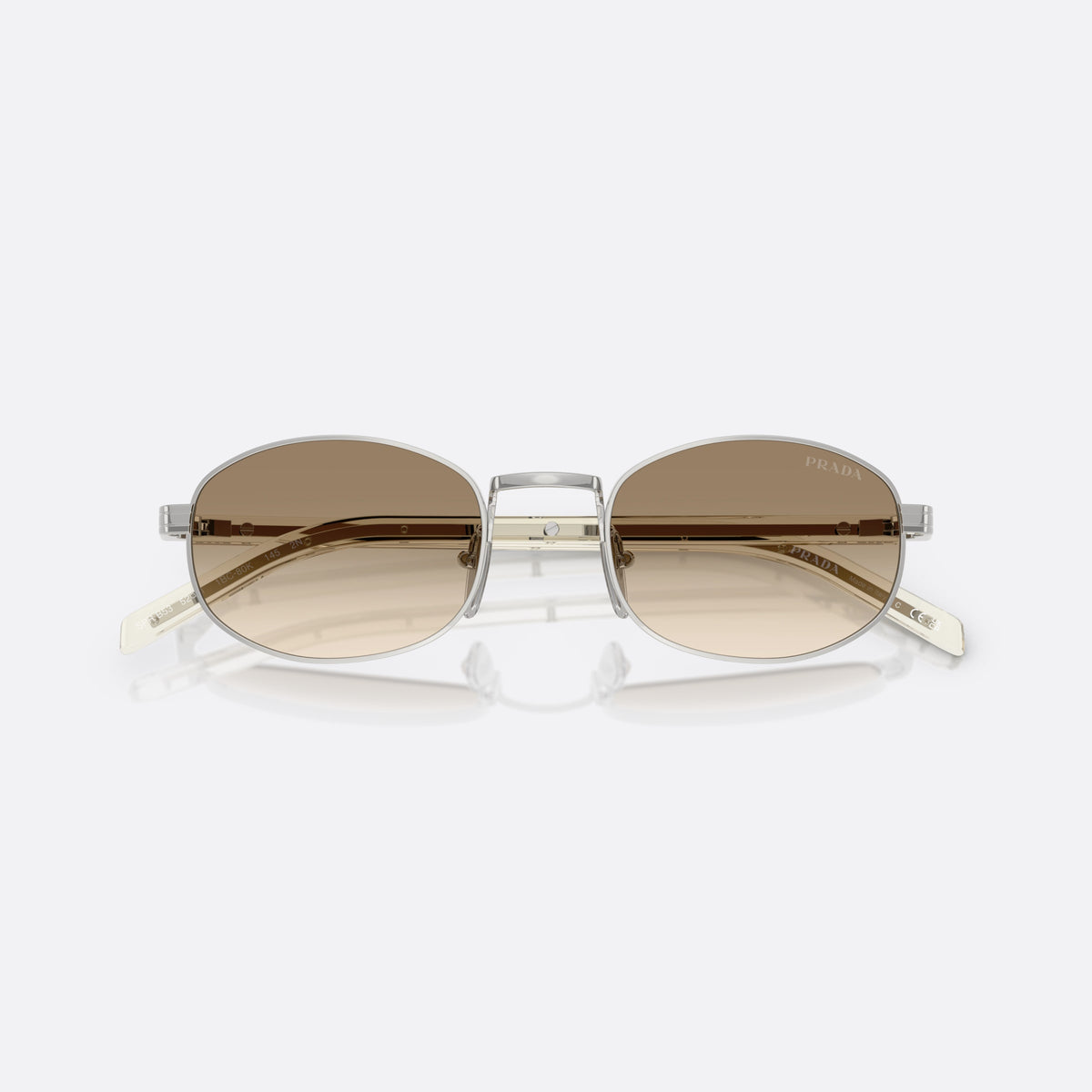 Prada PR B53S 1BC80K sunglasses, silver oval frame for women, plain metal bridge, brand lettering on temples, folded