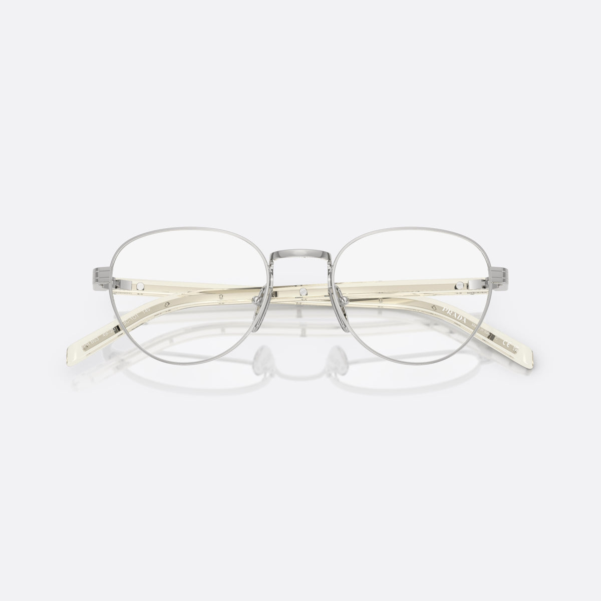 Rame ochelari de vedere Prada PR B53V 1BC1O1, rotunzi argintiu, pentru femei, punte metalică simplă, literele brandului pe brațe, cu brațele pliate