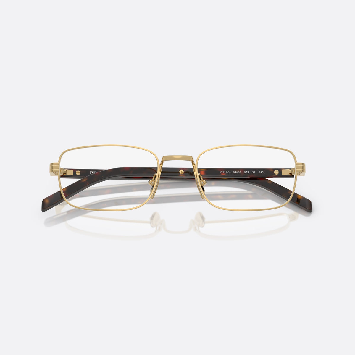 Prada PR B54V 5AK1O1 eyeglasses, gold visor frame for women, plain metal bridge, brand lettering on temples, folded