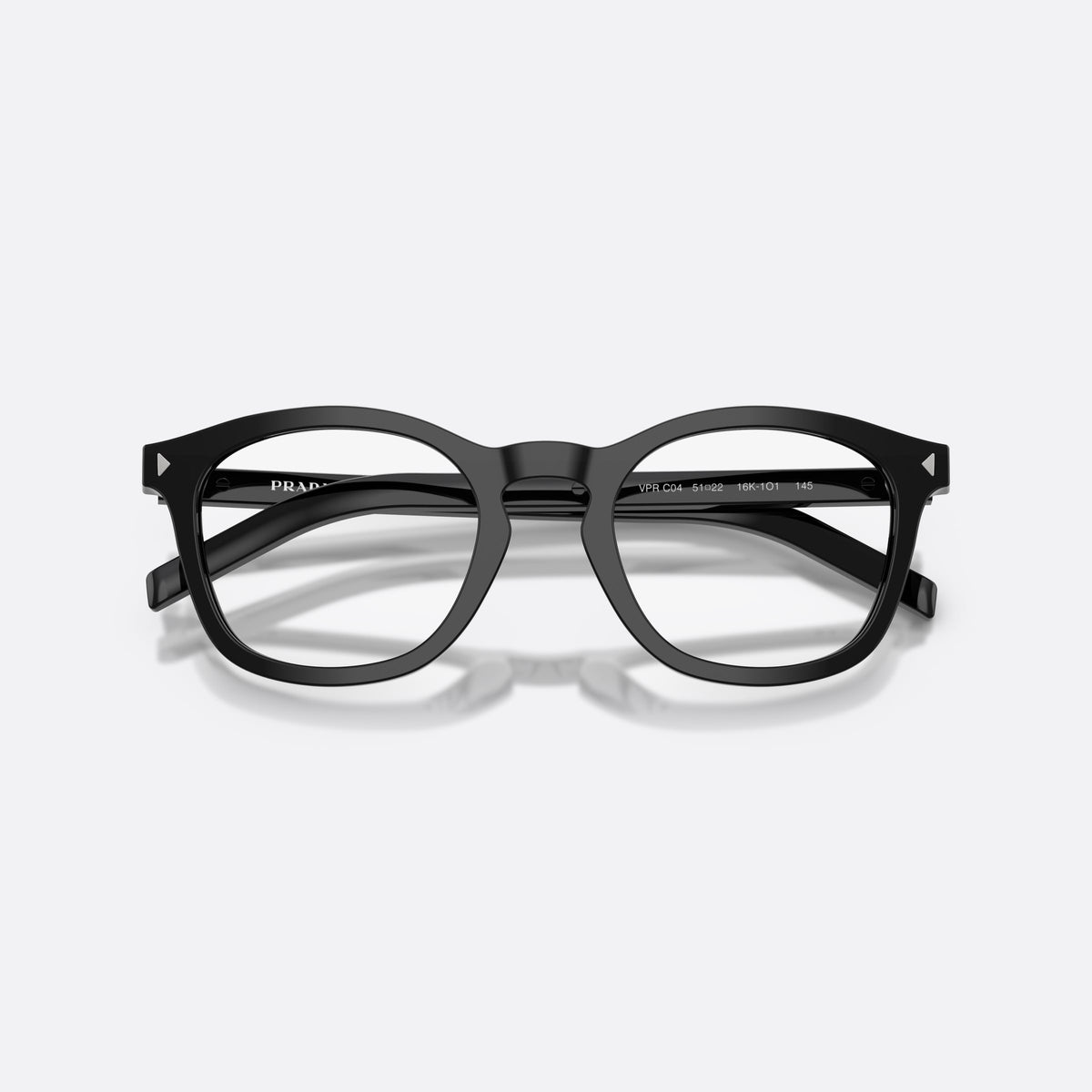 Prada PR C04V 16K1O1 eyeglasses, black pillow frame for men, brand lettering on temples, slim tapered temples, folded