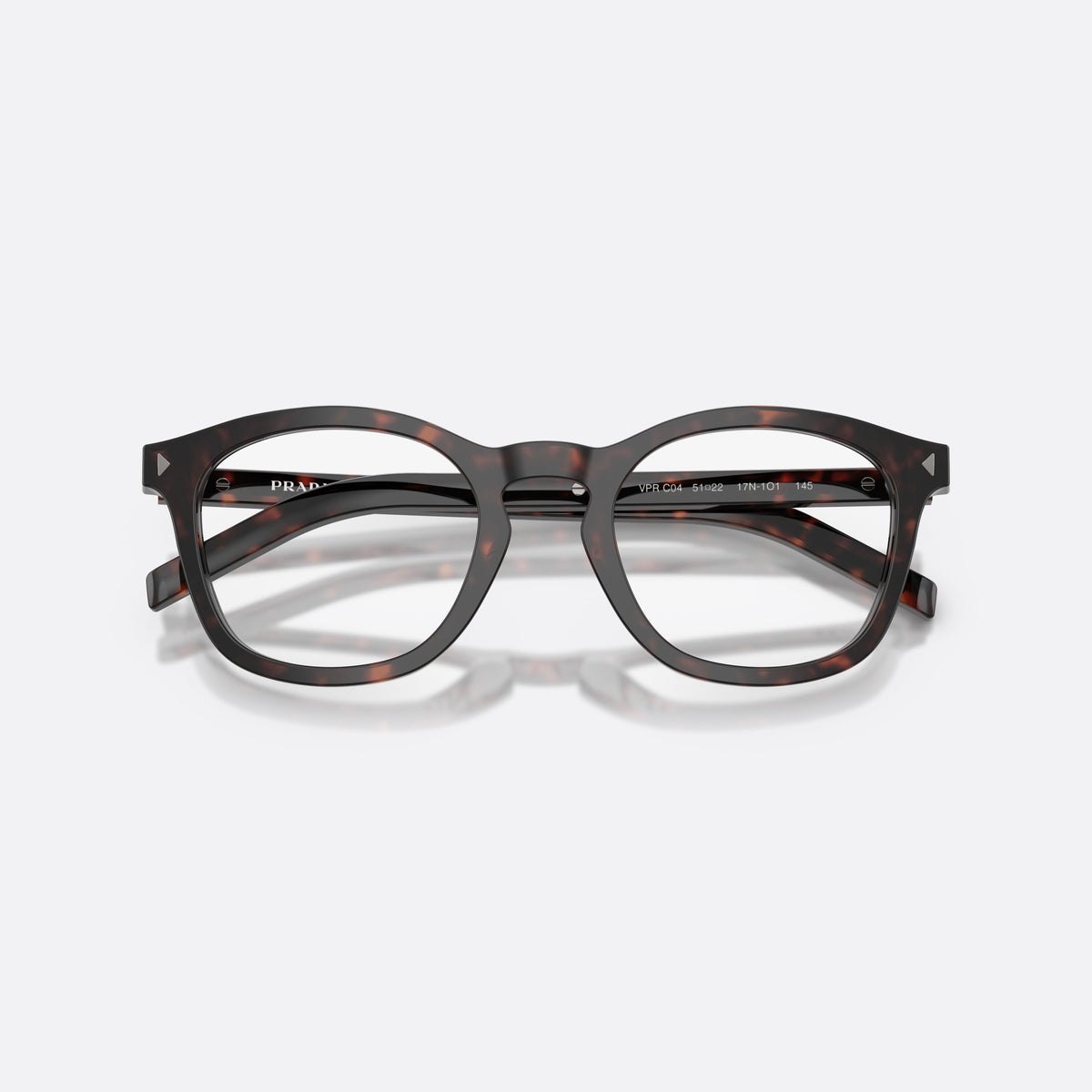 Prada PR C04V 17N1O1 eyeglasses, havana pillow frame for men, brand lettering on temples, full-rim frame, folded