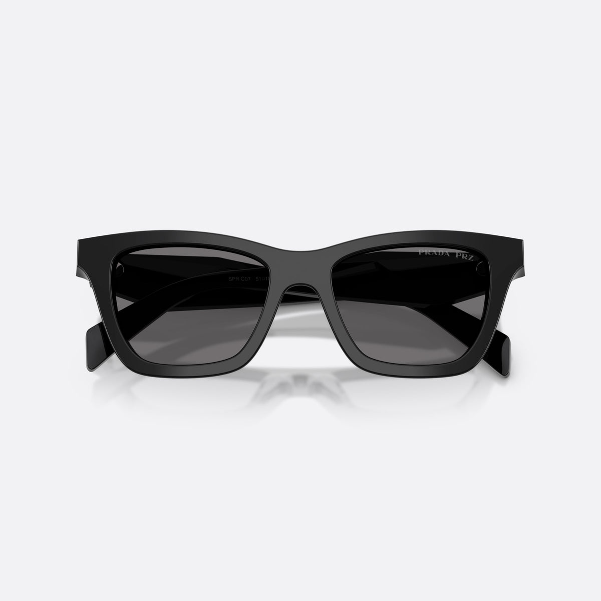 Prada PR C07S 16K90T sunglasses, black butterfly frame for women, plain integrated bridge, brand lettering on temples, folded
