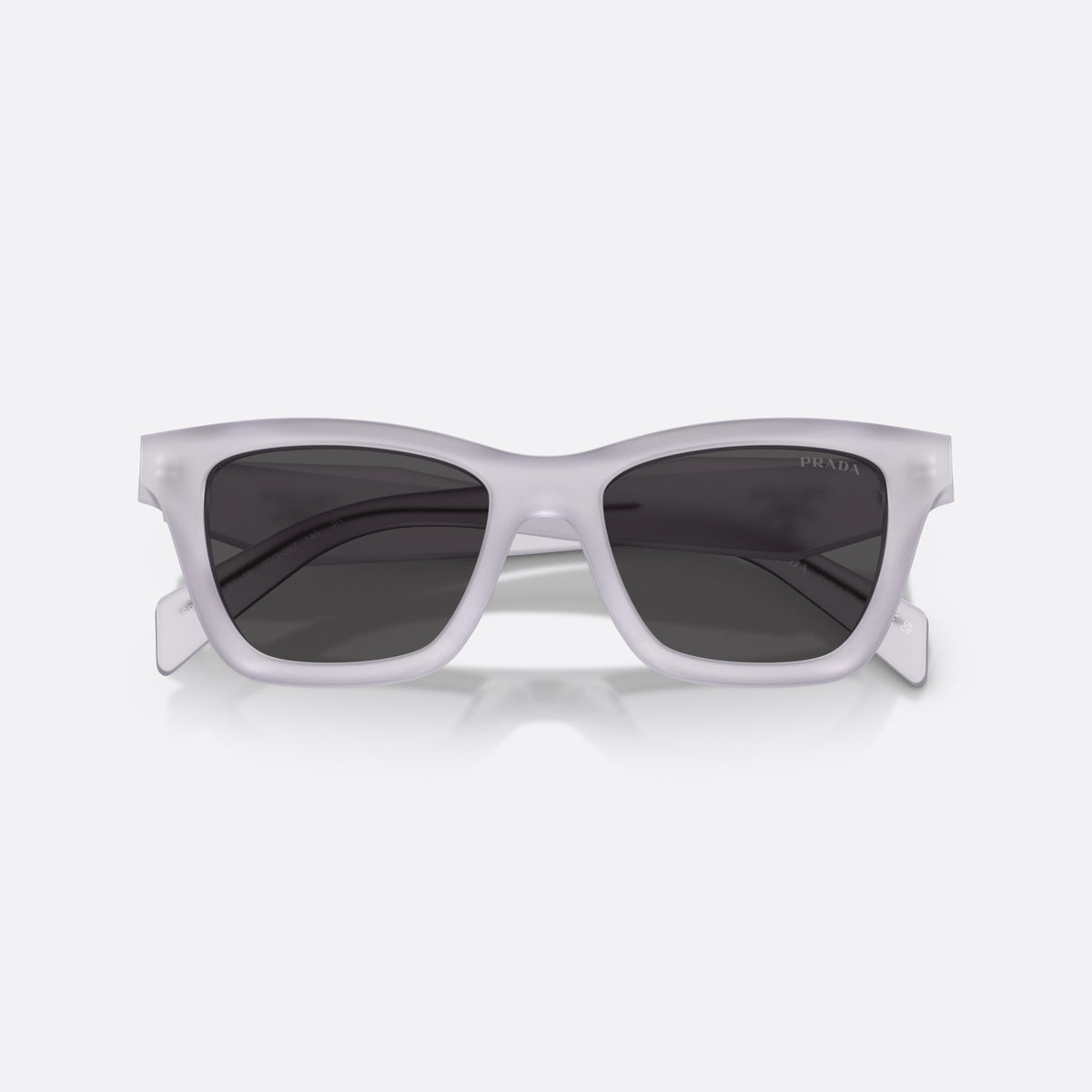 Prada PR C07S 22G08Z sunglasses, clear butterfly frame for women, plain bridge, brand lettering on the temples, full-rim frame, folded